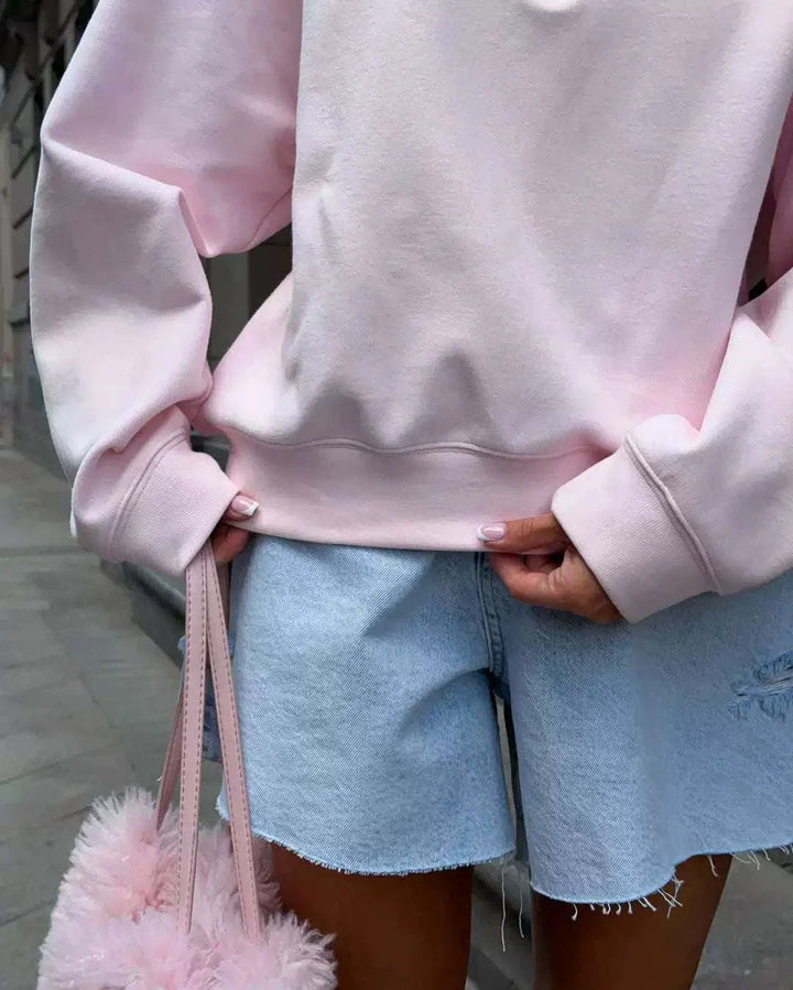 سويت شيرت نسائي زهري ناعم بأكمام واسعة وقماش مبطن مريح