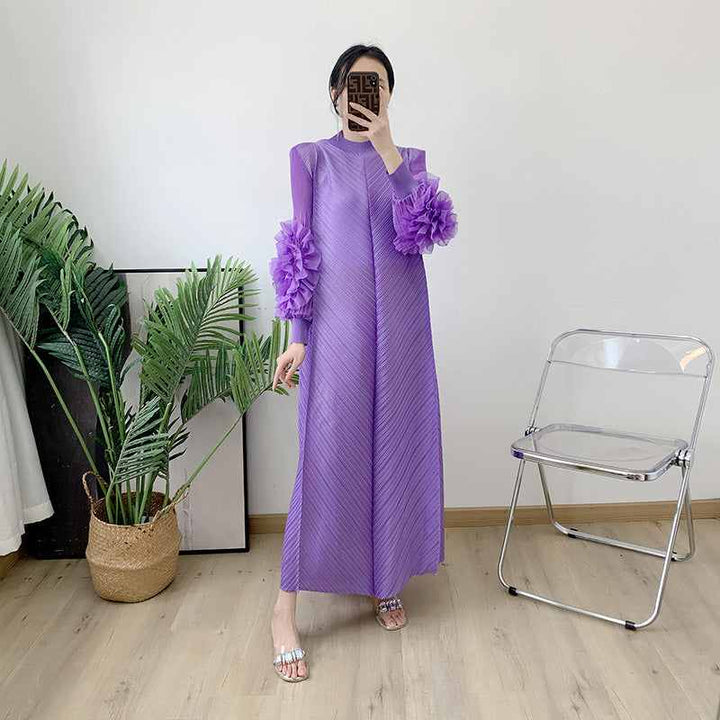 loose purple dress with floral embellished sleeves in modern setting