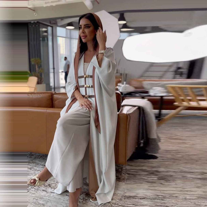 Elegant open Abaya with leather belts and color-blocked details, perfect for contemporary and formal occasions.