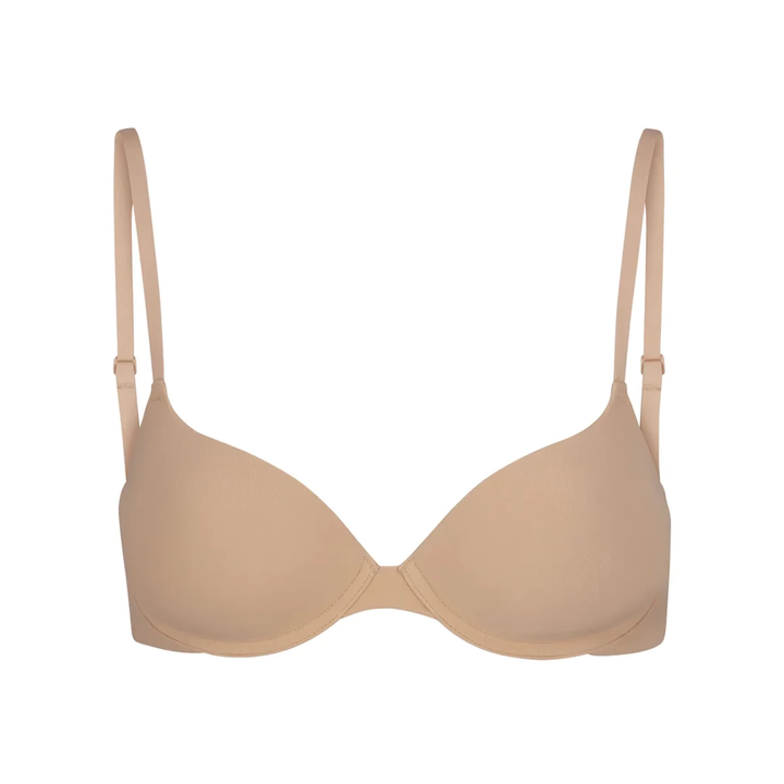 Soft supportive beige bra with seamless design and adjustable straps, SKIMS multi-color collection