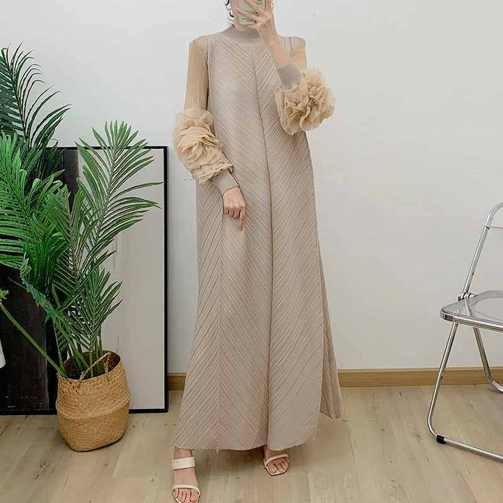 Elegant long loose dress with floral embellished transparent sleeves in solid color.