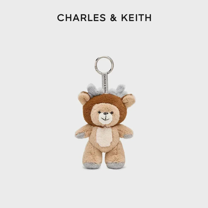 Plush teddy bear keychain with deer antlers by Charles & Keith, soft textured accessory for bags or keys.