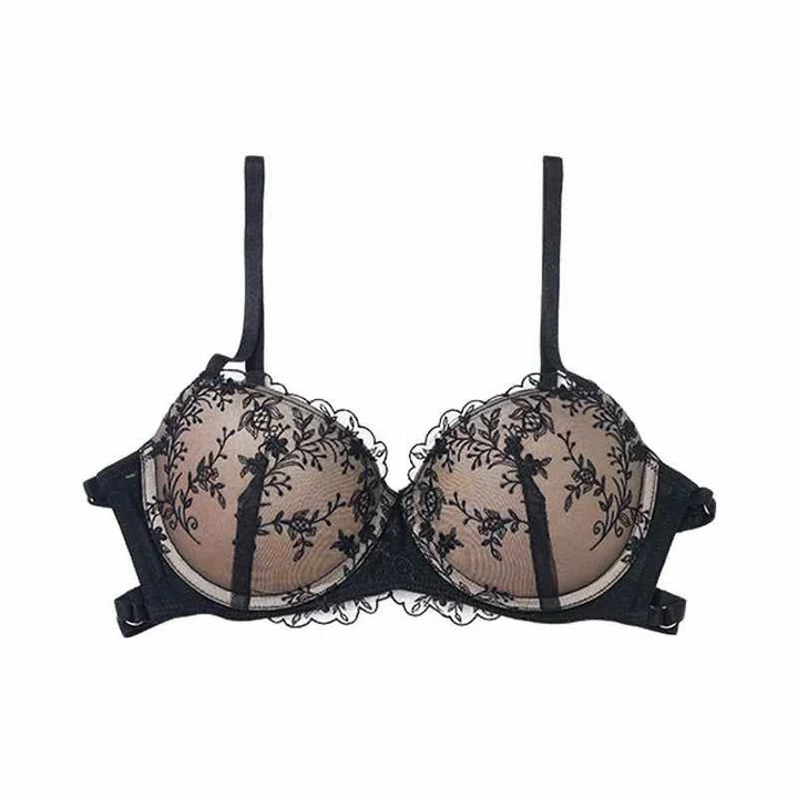 Black lace embroidered SKIMS Kardashian Gathering lingerie bra with adjustable straps and sheer floral design.