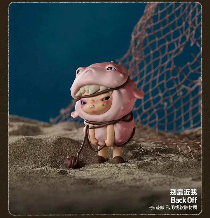 POP MART Hirono Echo Series figurine "Back Off" on sand with net background.