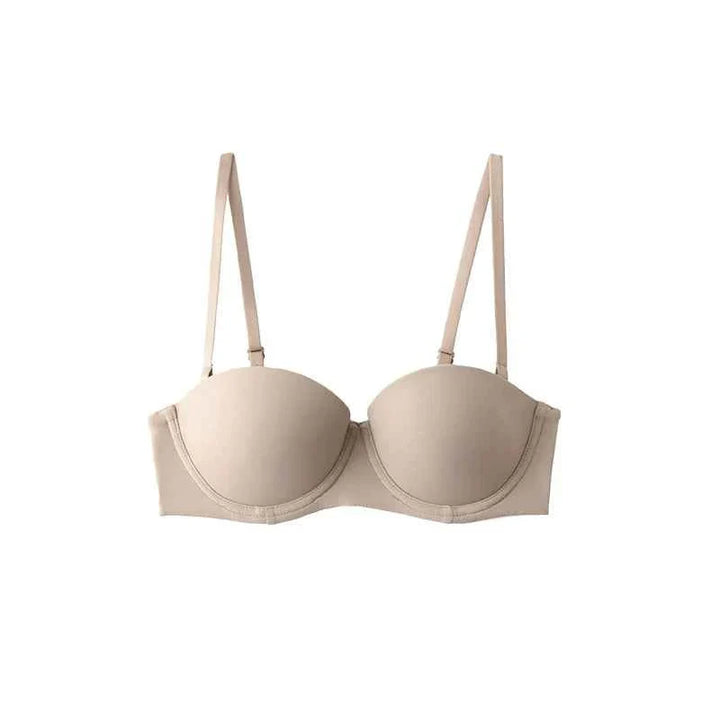 SKIMS Kardashian Women's Half Cup Bra in beige with adjustable detachable straps and light flexible underwire support.