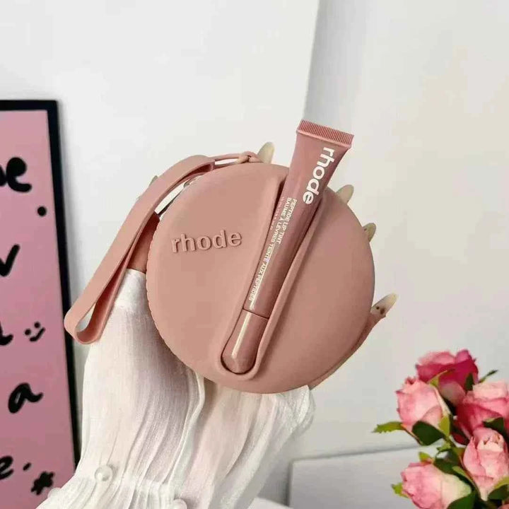 Rhode Peptide Lip Tint in mauve pink with matching round silicone pouch for deep moisturizing and soft color finish