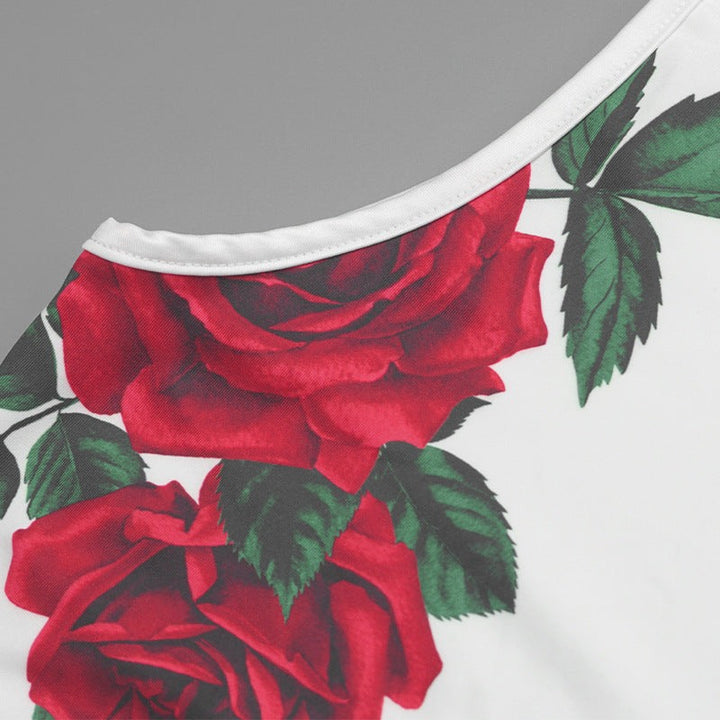 Sleeveless dress with red rose print on a slim, long design.