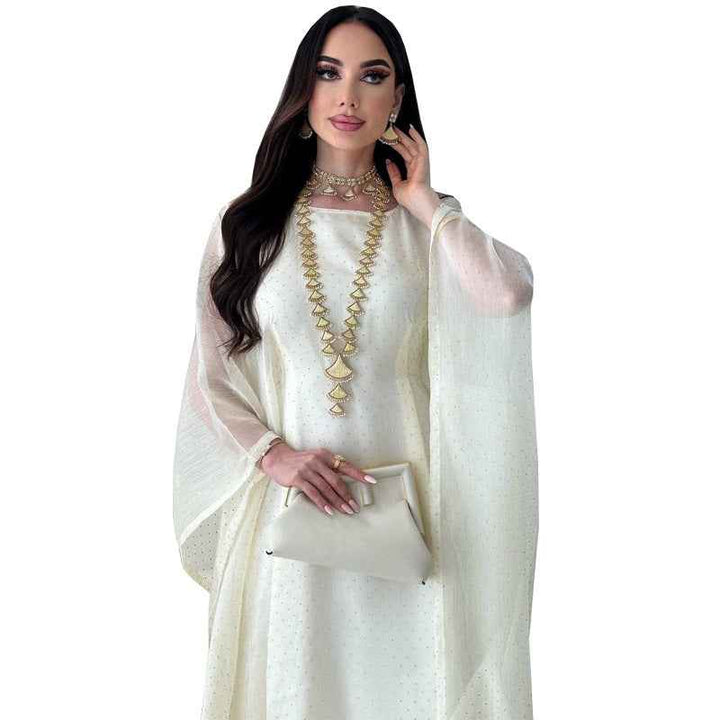 Elegant crystal-embellished royal dress with loose fit and wide sleeves.