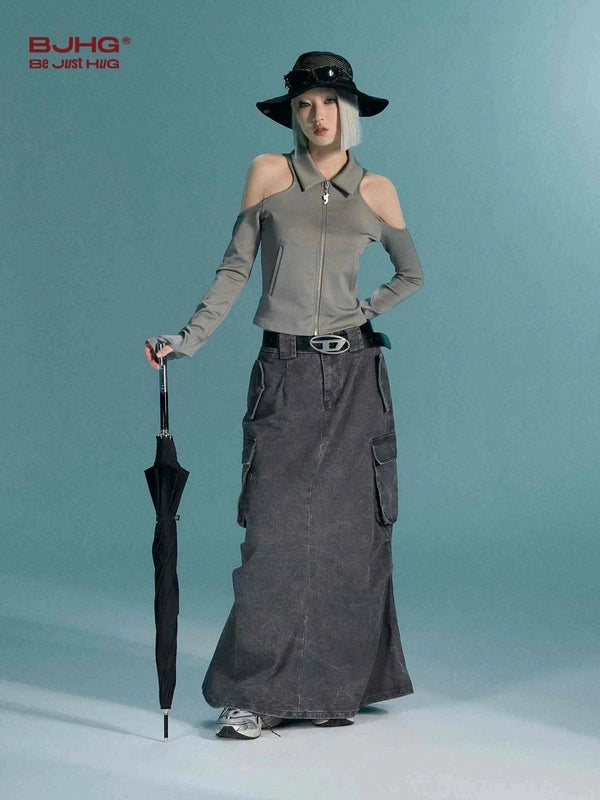 تنورة جينز woman wearing long black cargo denim skirt holding black umbrella against blue background