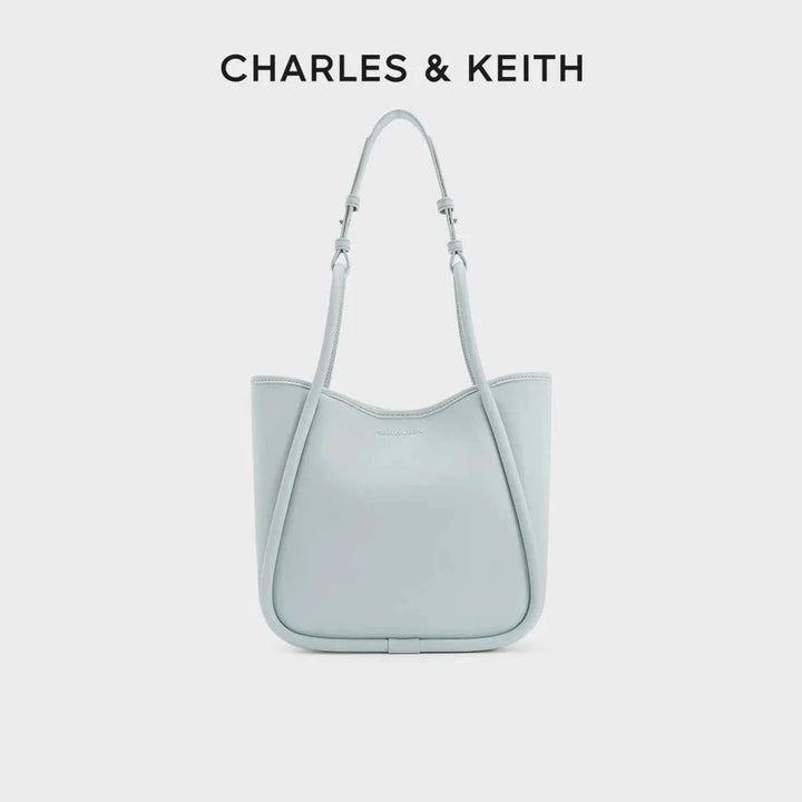 Light blue CHARLES & KEITH shoulder bag with adjustable straps and sleek design