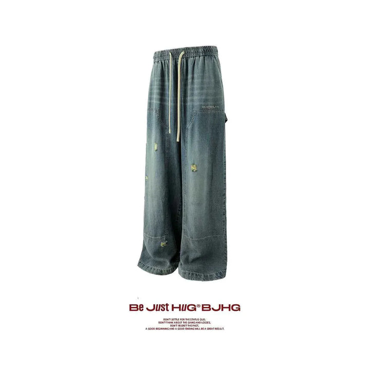 Wide street-style jeans in faded denim with loose fit and distressed details