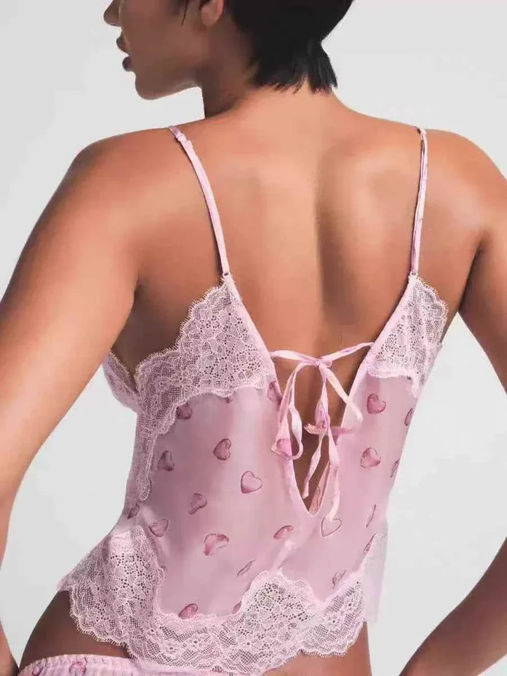 Back view of SKIMS lace heart print pink sleep set with delicate lace trim and adjustable straps