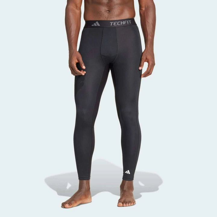 ليجن رياضي سريع الجفاف من أديداس بتصميم مرن وخفيف مع خصر مطاطي وشعار TECHFIT للتمارين المكثفة