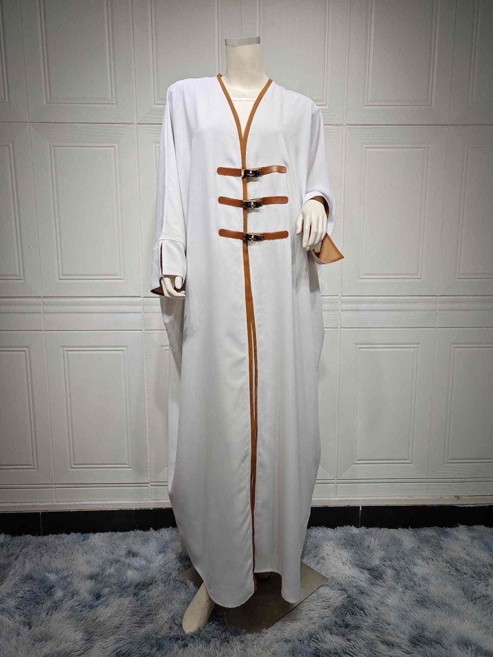 Modest white abaya with leather straps and color-blocked edges, elegant and suitable for formal occasions.