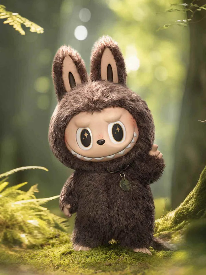 Pop Mart THE MONSTERS vinyl doll in a brown bunny suit, outdoors in a forest setting.