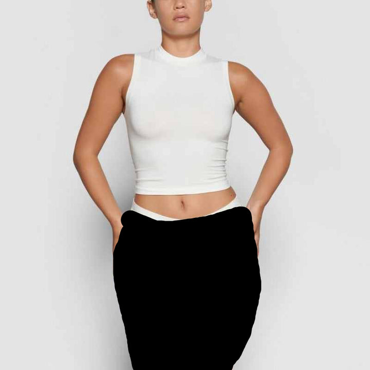 SKIMS sleeveless mock neck tank top in white with soft stretchy fabric for a sleek fit