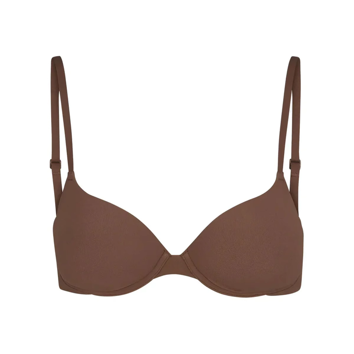 Soft supportive brown bra with adjustable straps and seamless design, SKIMS multi-color collection.