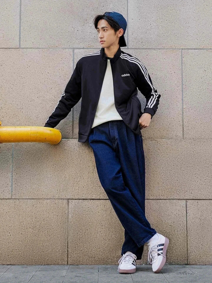 Adidas | أديداس جاكيت كاجوال أسود بخطوط بيضاء تصميم خريفي مريح وخفيف الوزن مع سحاب وجيوب جانبية