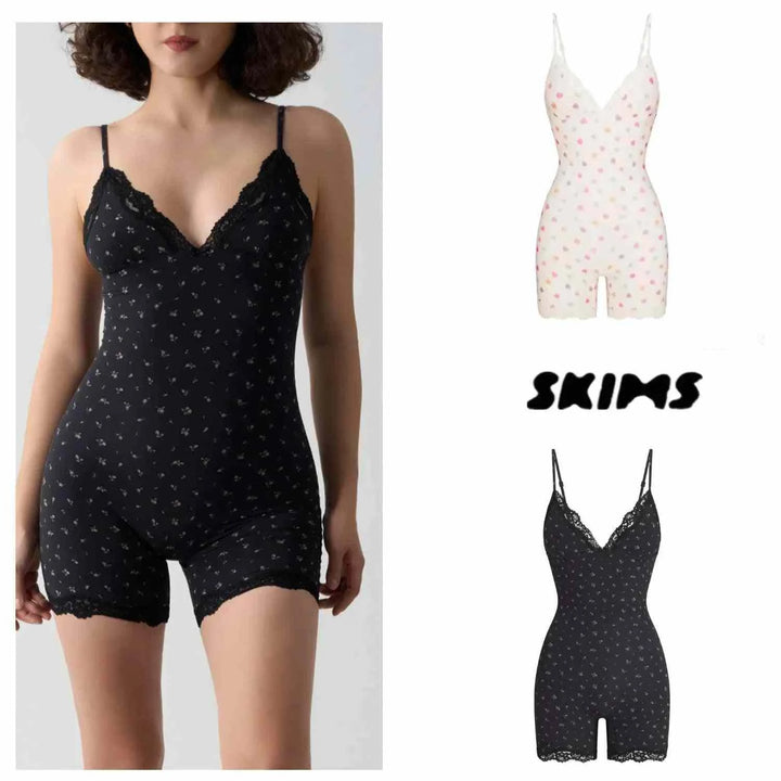 Soft laceSKIMS Kardashian bodysuit with delicate floral and heart prints in black and white, featuring adjustable straps and a comfortable, stretchy fit.