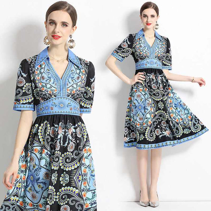 Elegant black dress with blue geometric prints, classic collar, mid-length sleeves, and flared skirt, perfect for 2023 summer formal occasions.