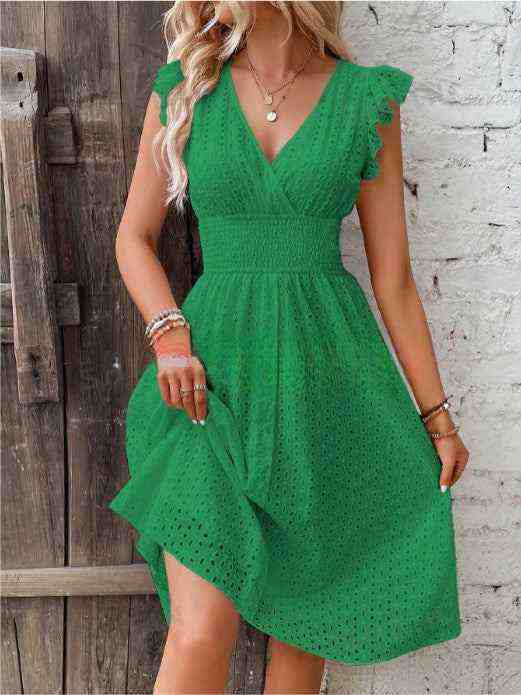 Elegant green V-neck dress with ruffle sleeves and cut-out design for plus-size women.