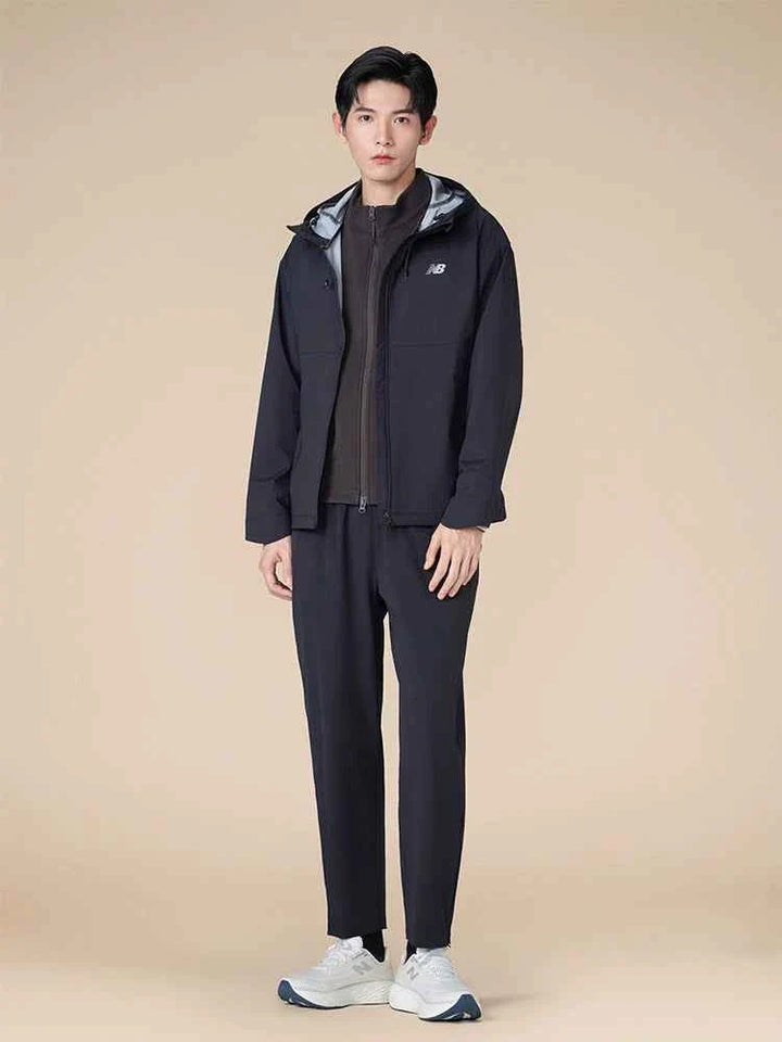 male model wearing black tracksuit with white New Balance Fresh Foam X 1080 v14 running shoes