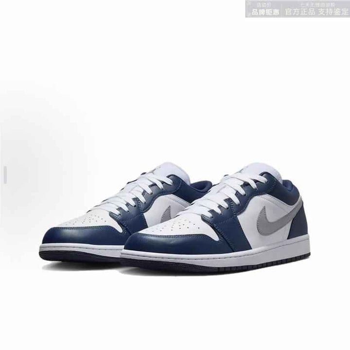 Air Jordan 1 Low in white, midnight navy, and wolf grey with a classic 1985-inspired design.