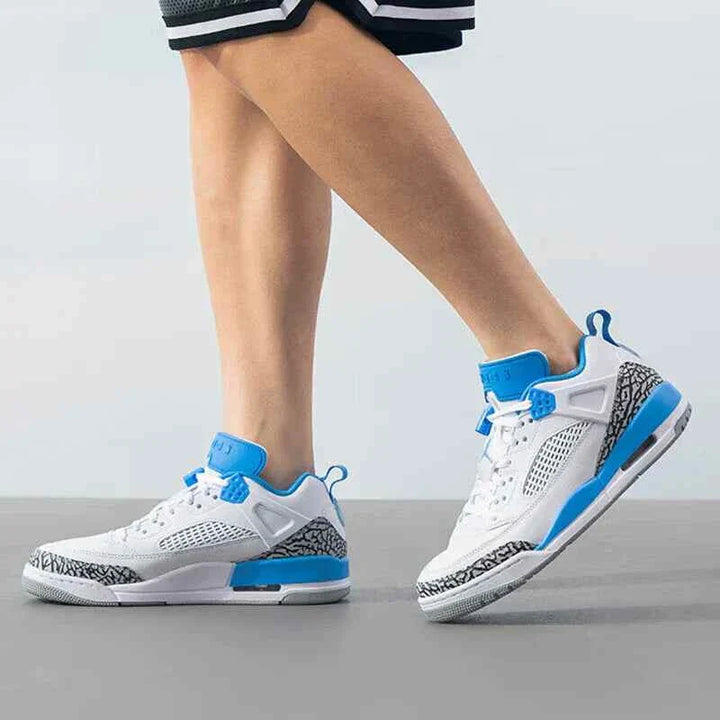 Nike men's JORDAN SPIZIKE LOW shoes in white, anthracite, wolf gray, and university blue.