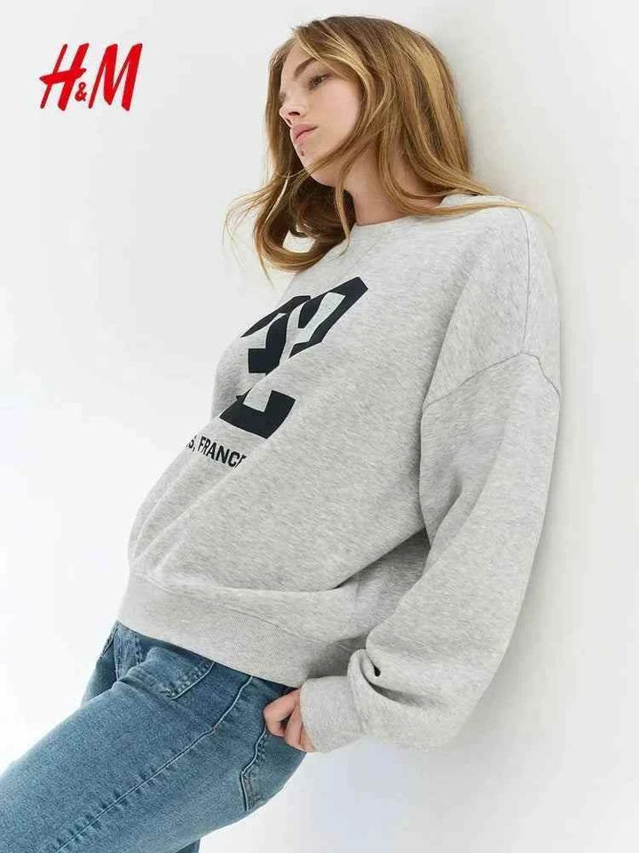 سويت شيرت نسائي كاجوال رمادي H&M بتصميم واسع ومريح للنساء