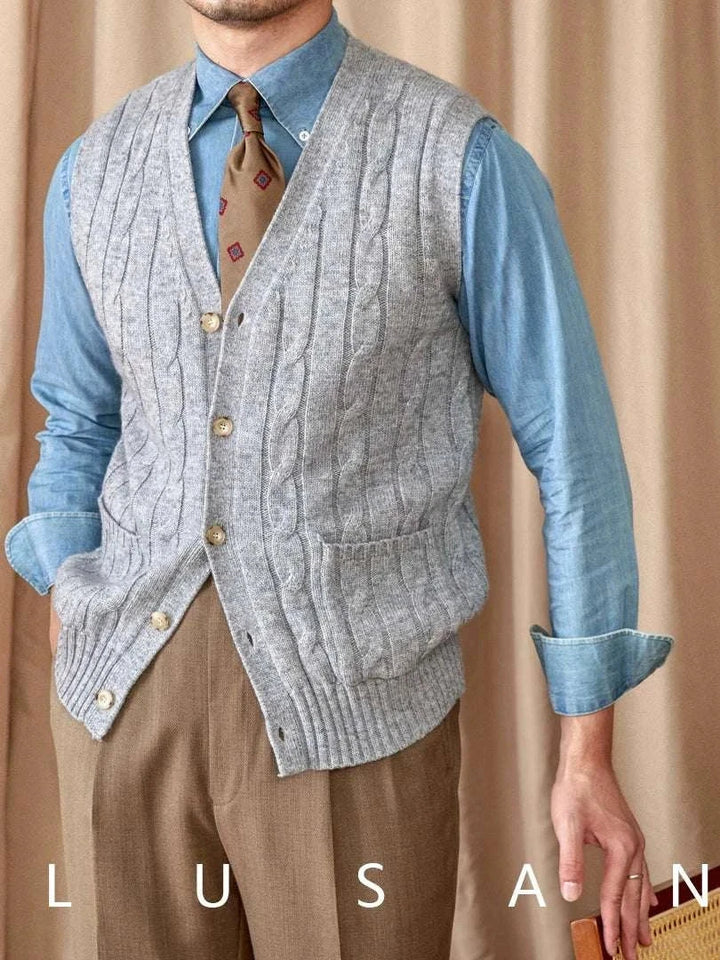 Mr. Lu San's wool cardigan vest grey cable knit with pearl buttons and pockets worn over blue shirt and brown tie