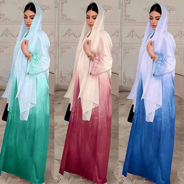 Elegant satin abaya with gradient colors and feather-trimmed sleeves, solid color gradient fashion.