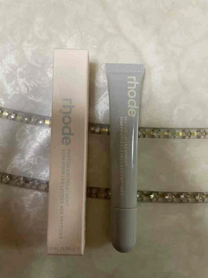 Rhode Skin مرطب شفاه ملون للترطيب والحماية البشرة.