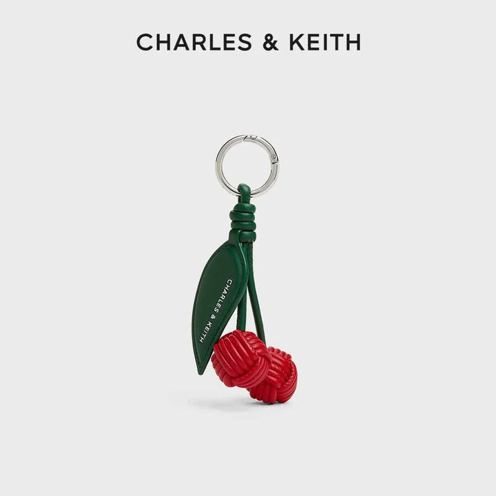 ميدالية تشارمز على شكل حبات كرزية حمراء مع ورقة خضراء من CHARLES & KEITH بتصميم مميز وأنيق