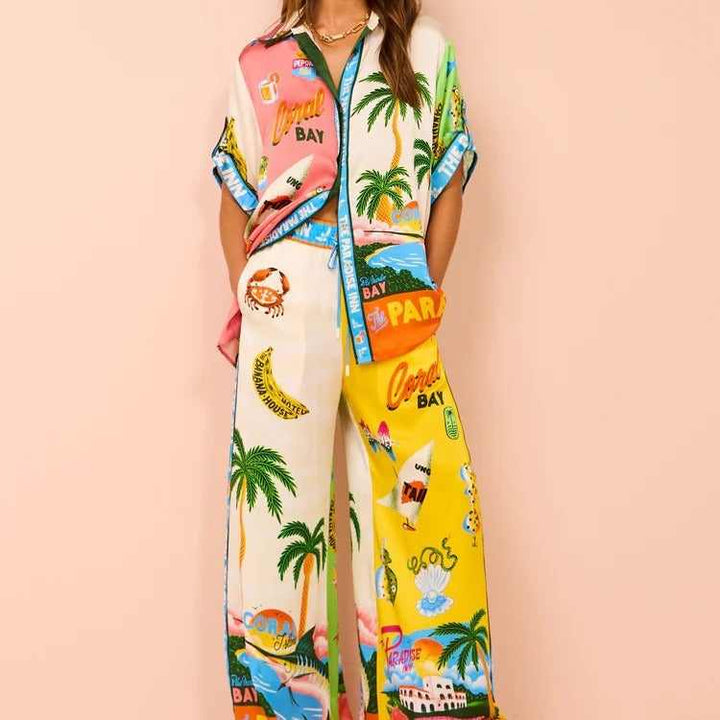 Color-blocked resort casual set with tropical print, short sleeves, and tethered design, European and American style.