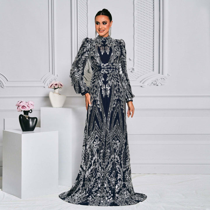 Luxurious long evening dress with puff sleeves and sparkling embroidery, perfect for elegant events.