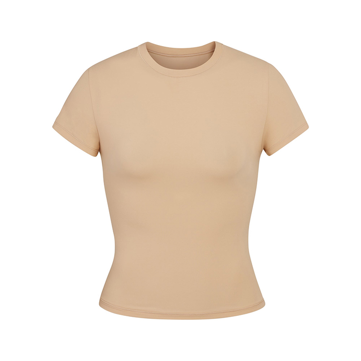 Skims short sleeve slimming shapewear t-shirt in beige with crew neck and fitted design.