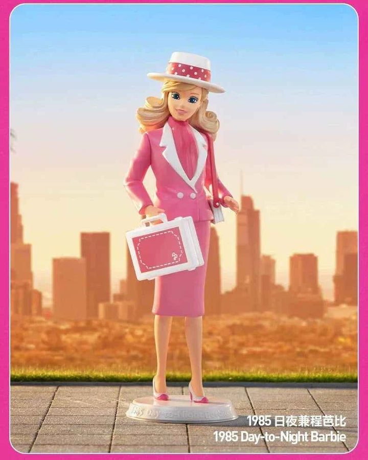 Barbie Fashion Series 1985 Day-to-Night Barbie figurine in pink outfit against city skyline.
