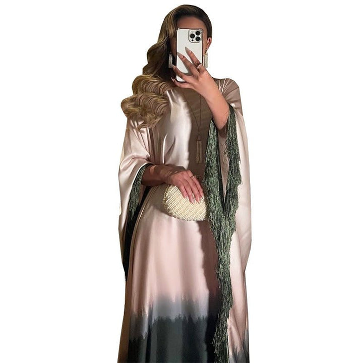 Middle Eastern satin dress with gradient design and tassel sleeves, suitable for elegant occasions.