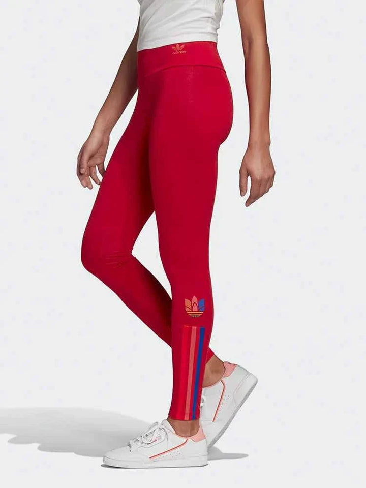 Red Adidas leggings with colorful side stripes and original Adidas logo, slim fit, flexible and comfortable for sporty and casual wear.