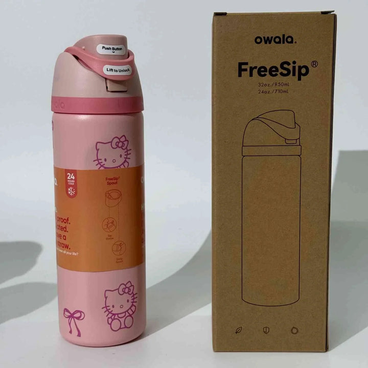 Pink Owala Thermos CupKitty Limited Edition with Hello Kitty design and FreeSip technology next to its brown packaging box.