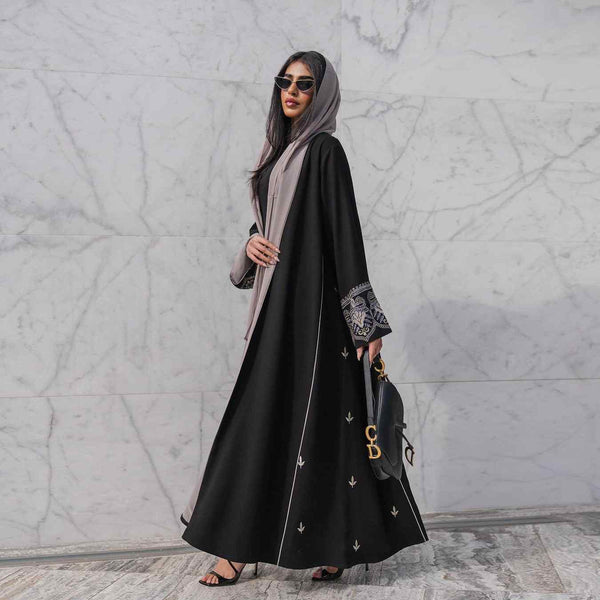 Elegant black abaya with embroidered sleeves and gold details, perfect for formal and casual occasions.