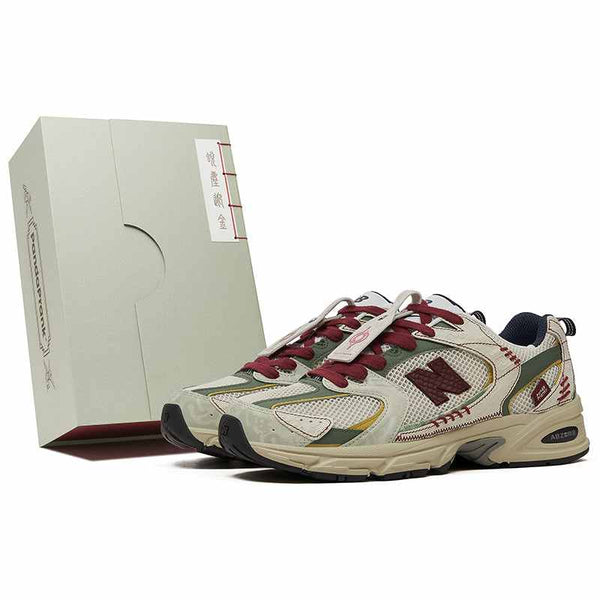 New Balance 530 PandaPrank Limited Edition sneakers with cream beige, olive green, dark red accents, embroidered details, and Japanese-inspired box.