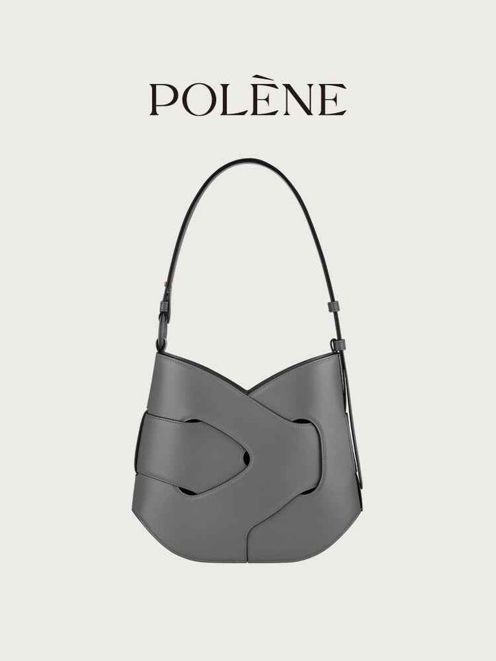 Polène Nodde Hobo handbag in black full grain smooth cowhide leather with adjustable shoulder strap and modern asymmetrical design.