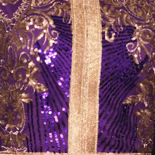 Luxurious purple Moroccan kaftan with elegant gold embroidery and decorative details.