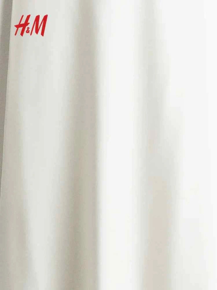 HM maxi skirt in soft woven fabric, white, with hidden elastic waistband and flared hem.
