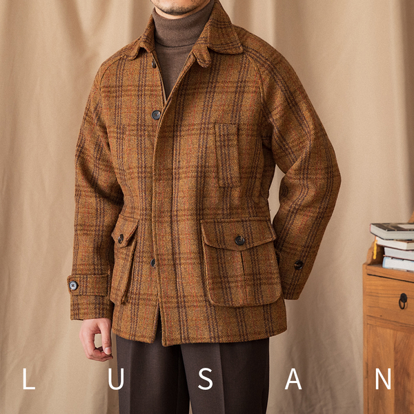 Mr. Lusan hunting tweed jacket in brown and orange plaid wool with buttoned pockets and adjustable cuffs