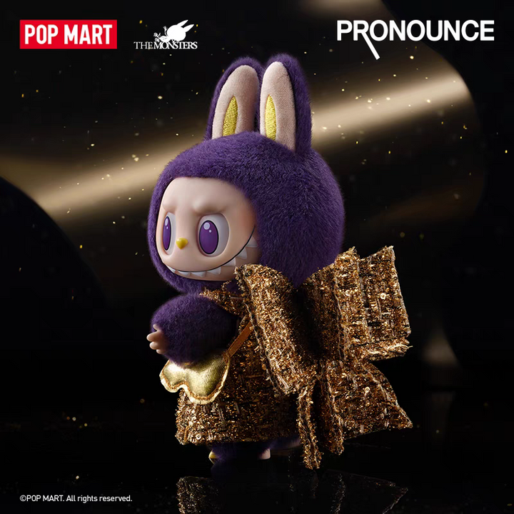 LABUBU x PRONOUNCE luxury vinyl plush doll with purple fur and rabbit ears, wearing a shimmering gold dress.