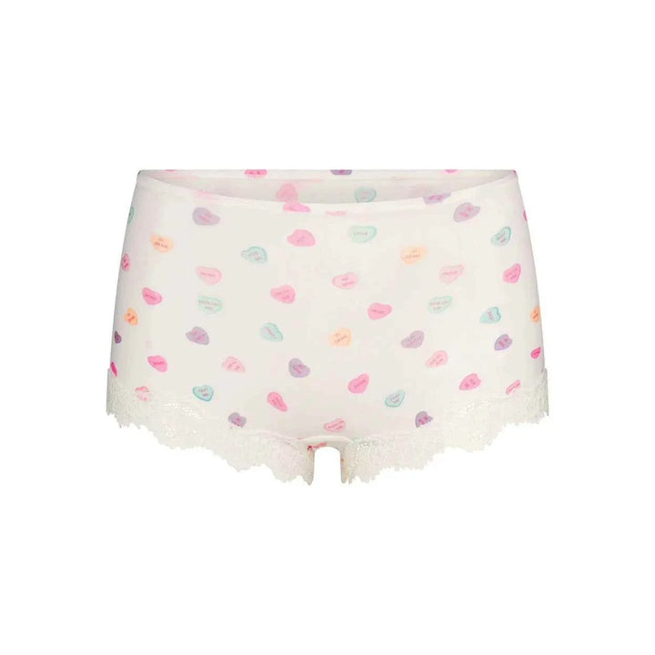 SKIMS FITS EVERYBODY printed white lace brief thong with soft, flexible polyamide fabric and elegant lace trim