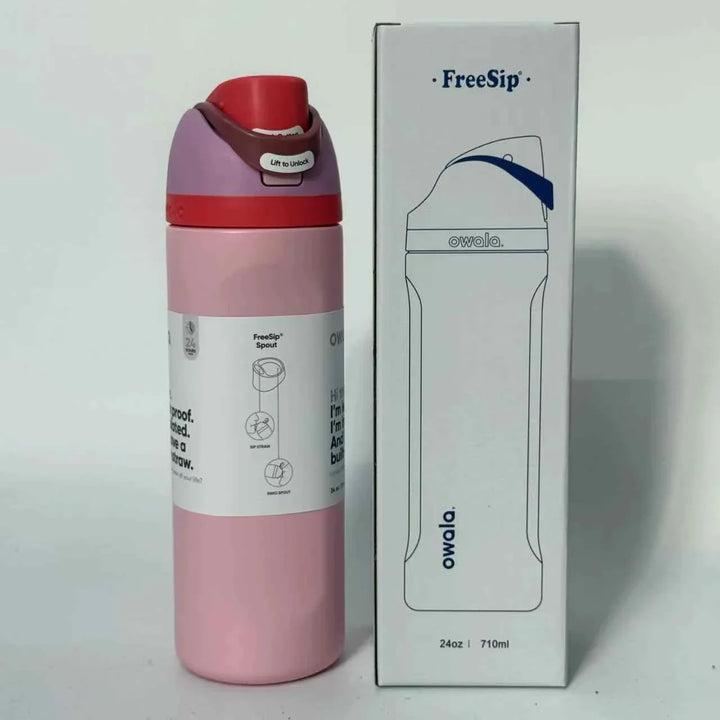 Pink Owala FreeSip stainless steel water bottle with dual spout design and leak-proof lid next to its white packaging box.