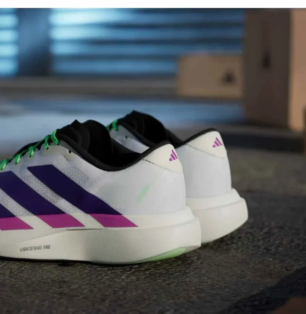 Adidas | أديداس حذاء جري فائق الخفة بتصميم سباق للرجال والنساء.